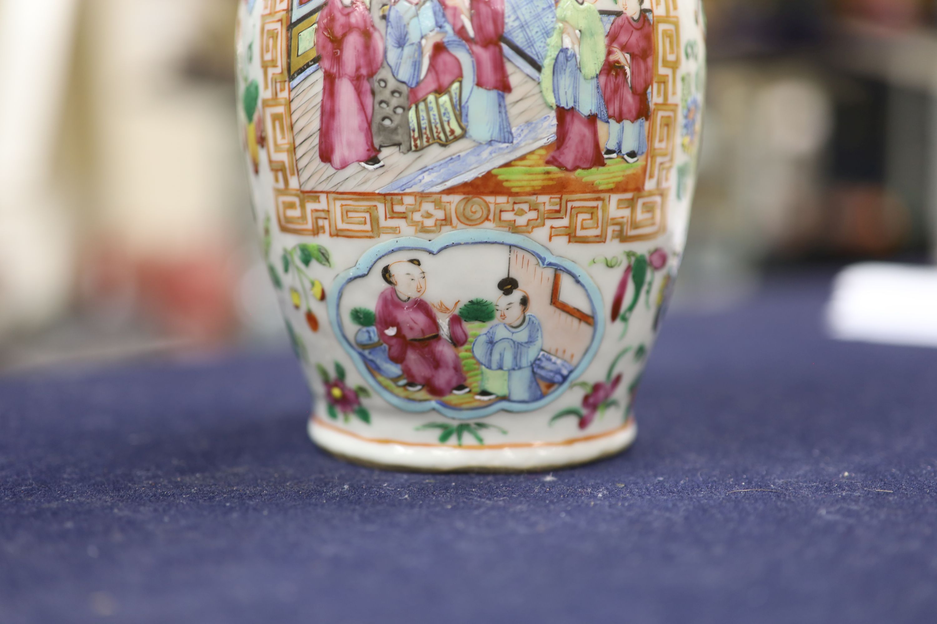 A Chinese famille verte jar and cover and a Canton famille rose vase, tallest 22cm